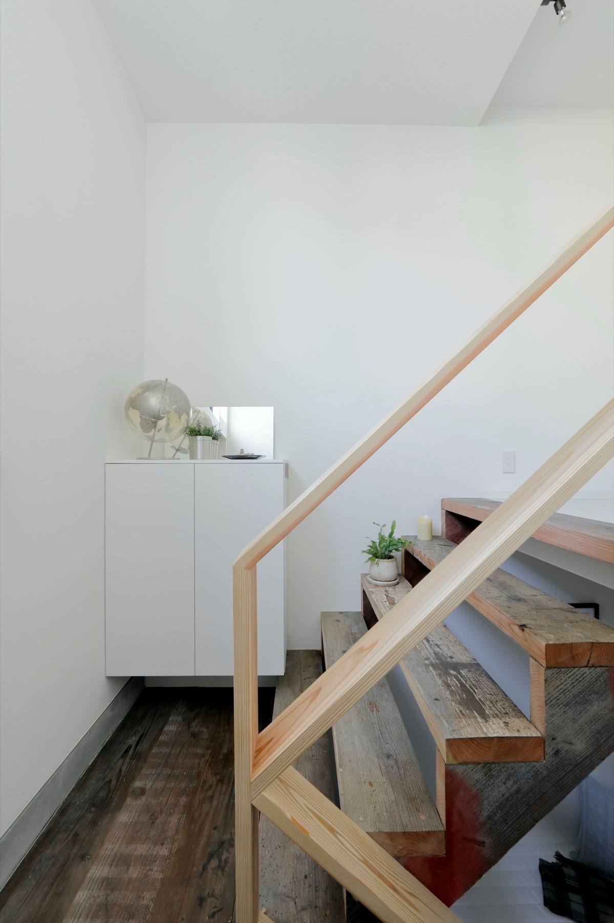 Inside Okushibu Residence — a stair and a quiet corner